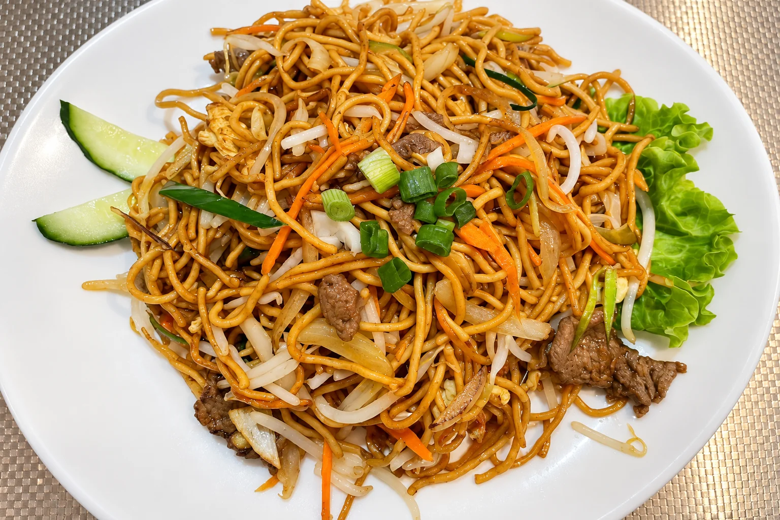 N5. Beef fried noodles on a white plate
